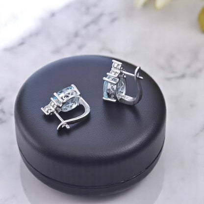 EMPRESS – NATURAL SKY BLUE TOPAZ GEMSTONE EARRINGS IN 925 STERLING SILVER