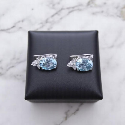 EMPRESS – NATURAL SKY BLUE TOPAZ GEMSTONE EARRINGS IN 925 STERLING SILVER