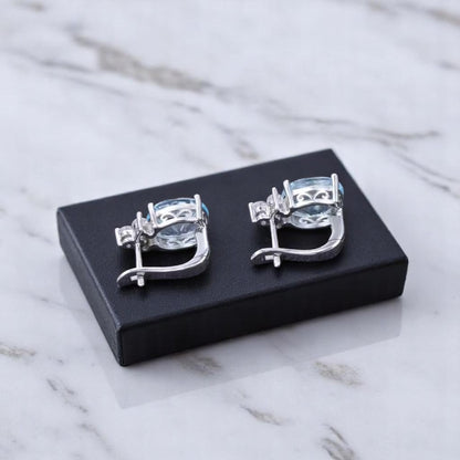EMPRESS – NATURAL SKY BLUE TOPAZ GEMSTONE EARRINGS IN 925 STERLING SILVER