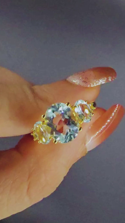 HARMONIA – BLUE TOPAZ TRILOGY GEMSTONE RING PLATED IN YELLOW GOLD